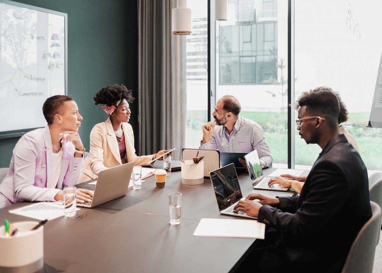 group of business professionals working in a meeting room