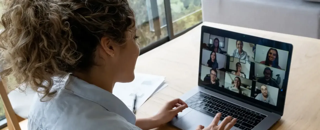 curly hair woman virtual meeting at home
