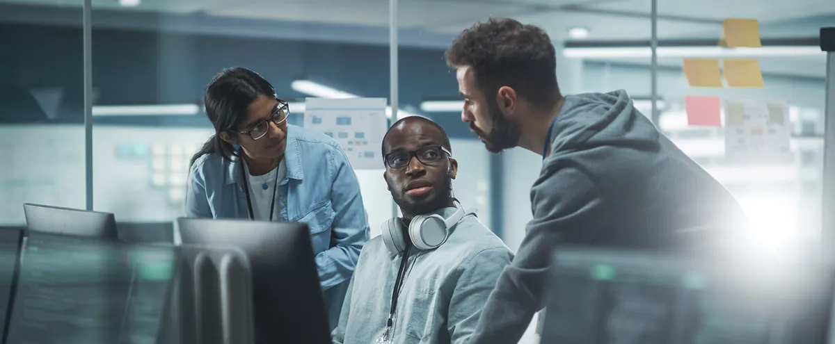 diverse group working together in a computer lab