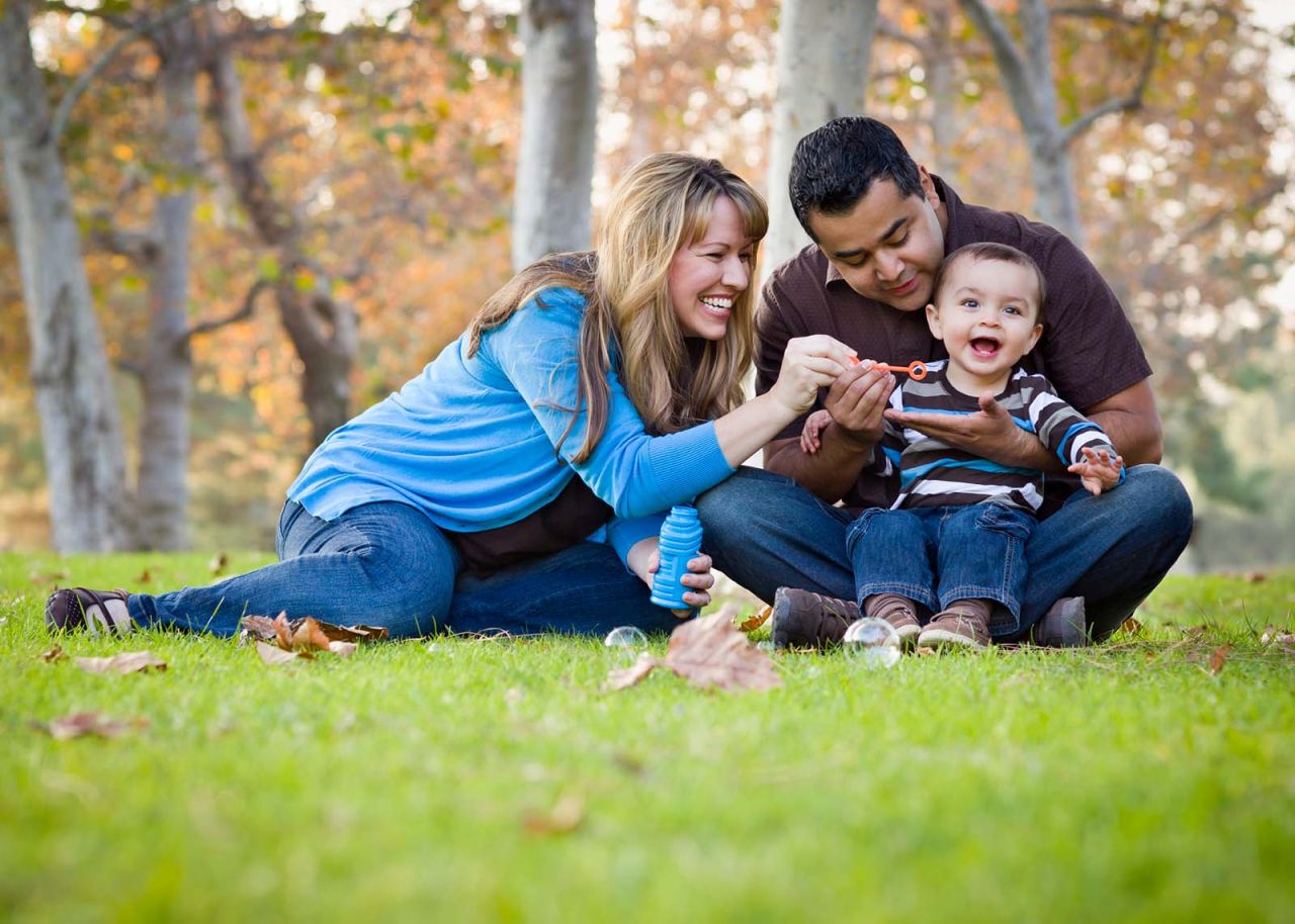 happy family playing at park