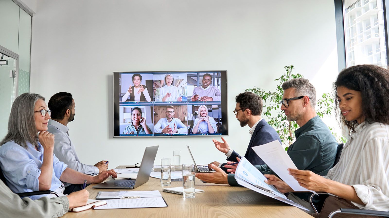 diverse associate video conference call modern office