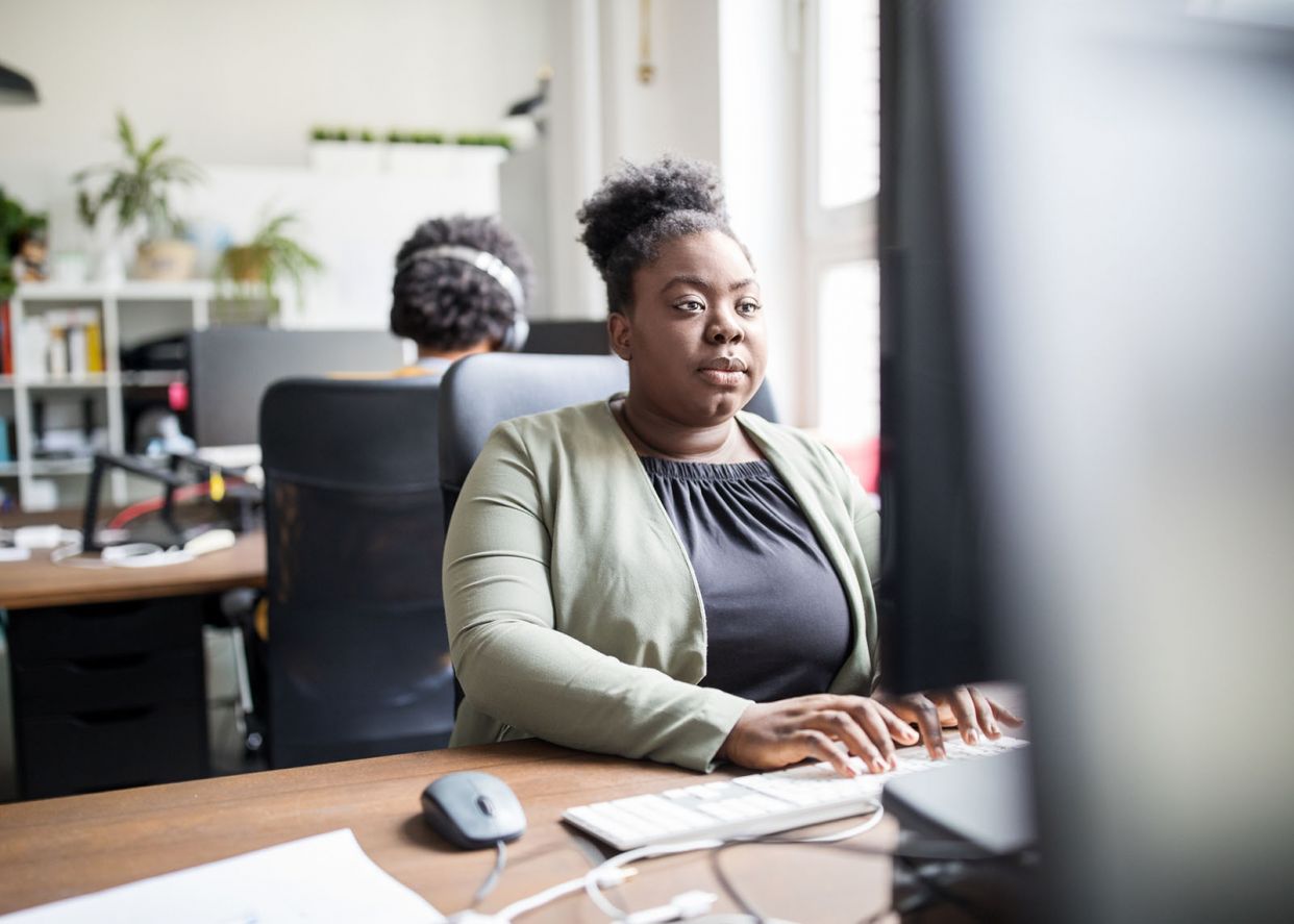 business woman working at desk focused