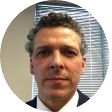 photo of Bob Patrick looking at the camera in front of a window