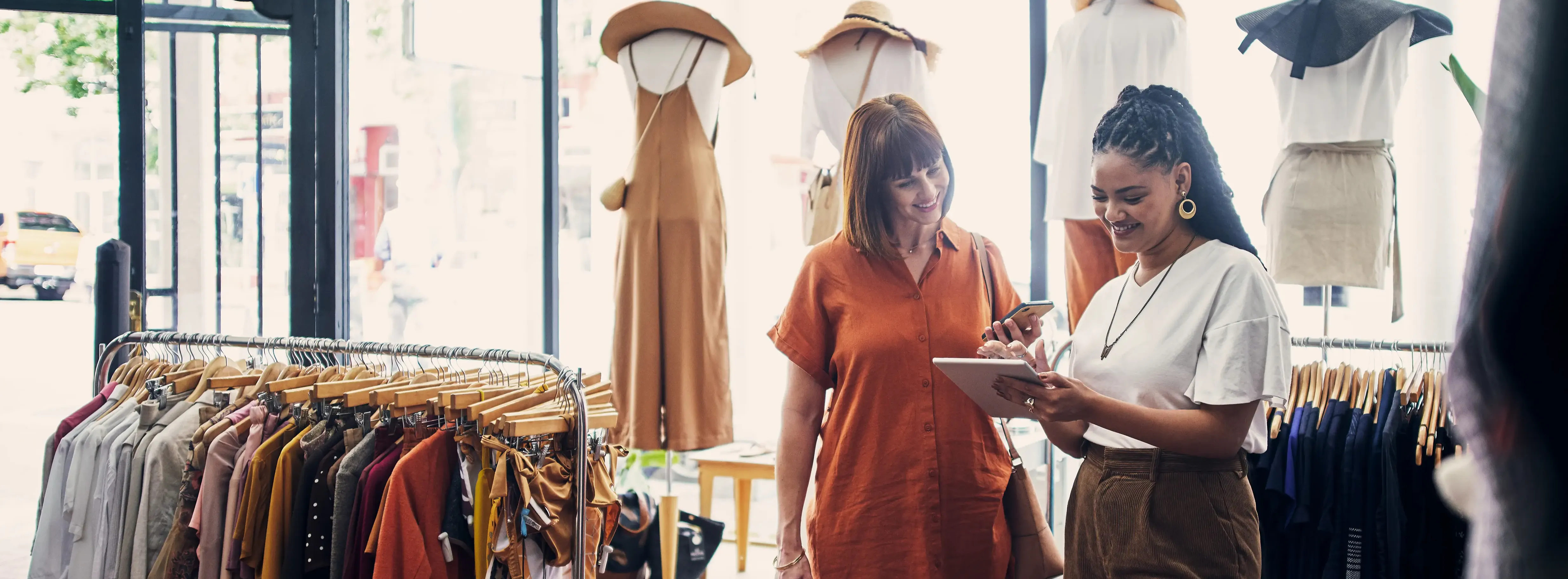 two women in store transaction of goods