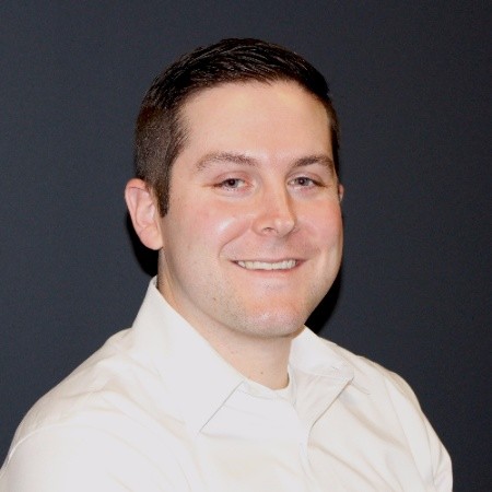 photo of Doug looking at the camera and smiling