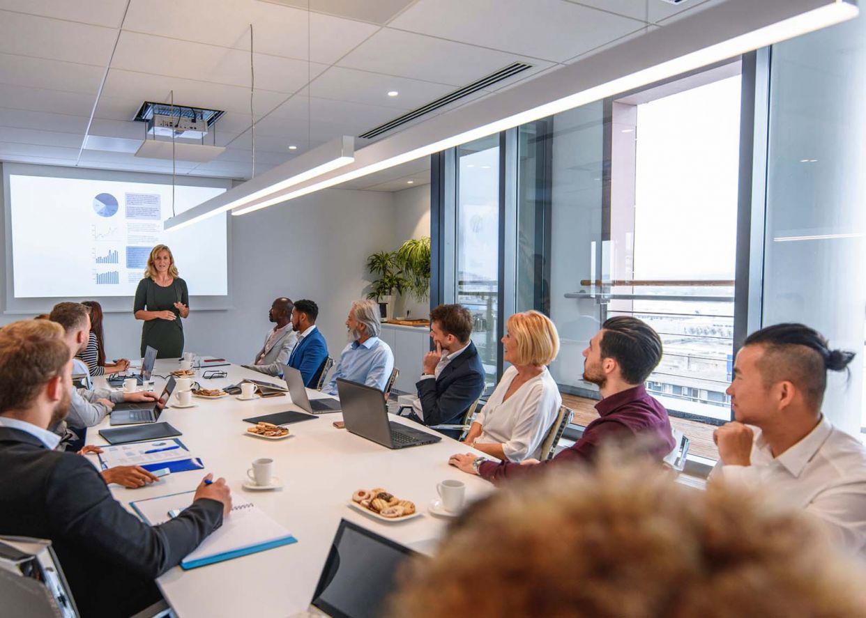 executive team meeting large diverse group