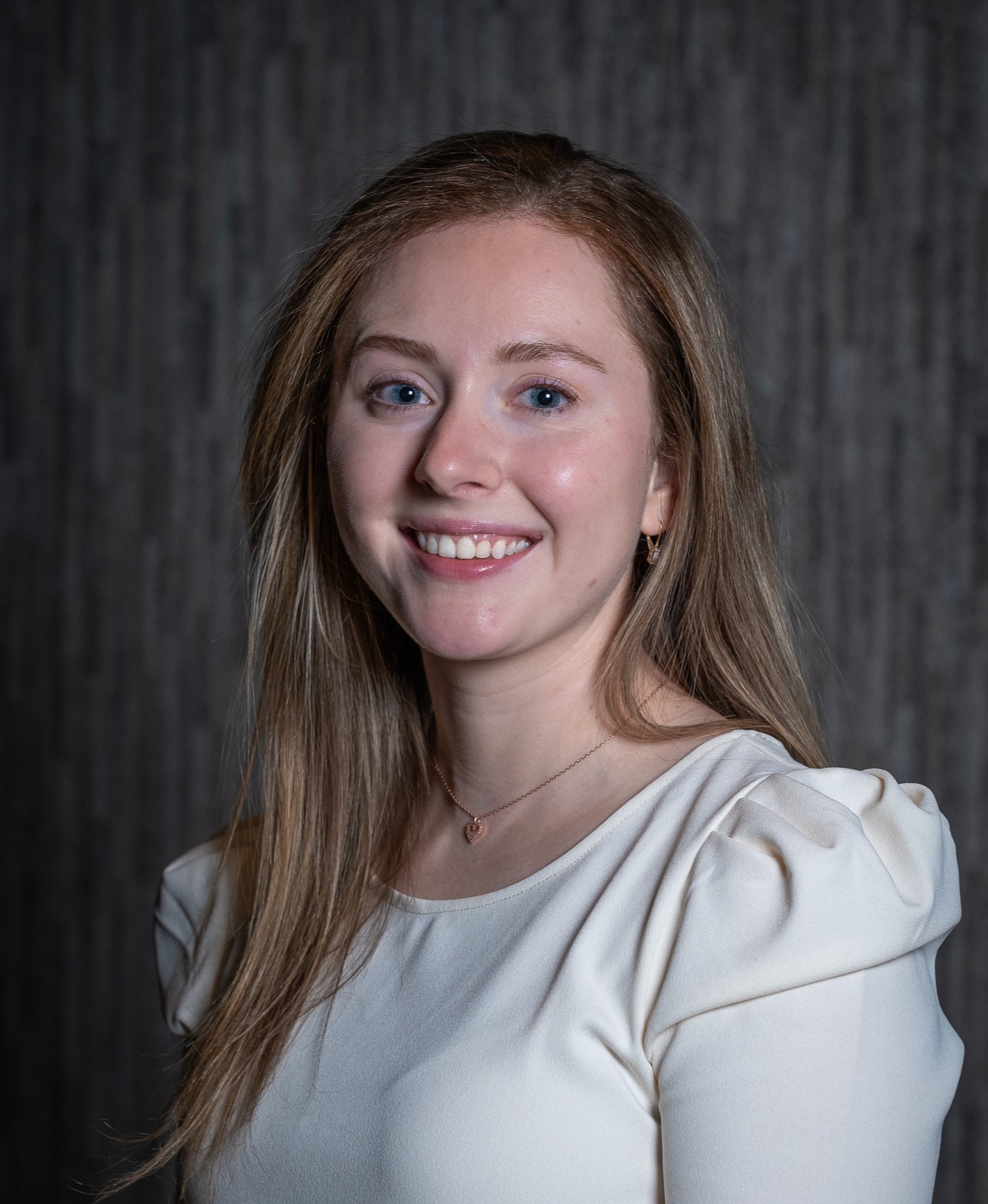 professional photo of Victoria Wiles smiling at the camera