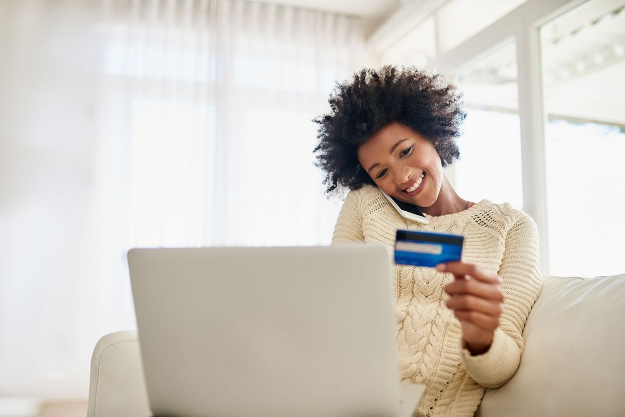 woman-on-phone-paying-with-credit-online