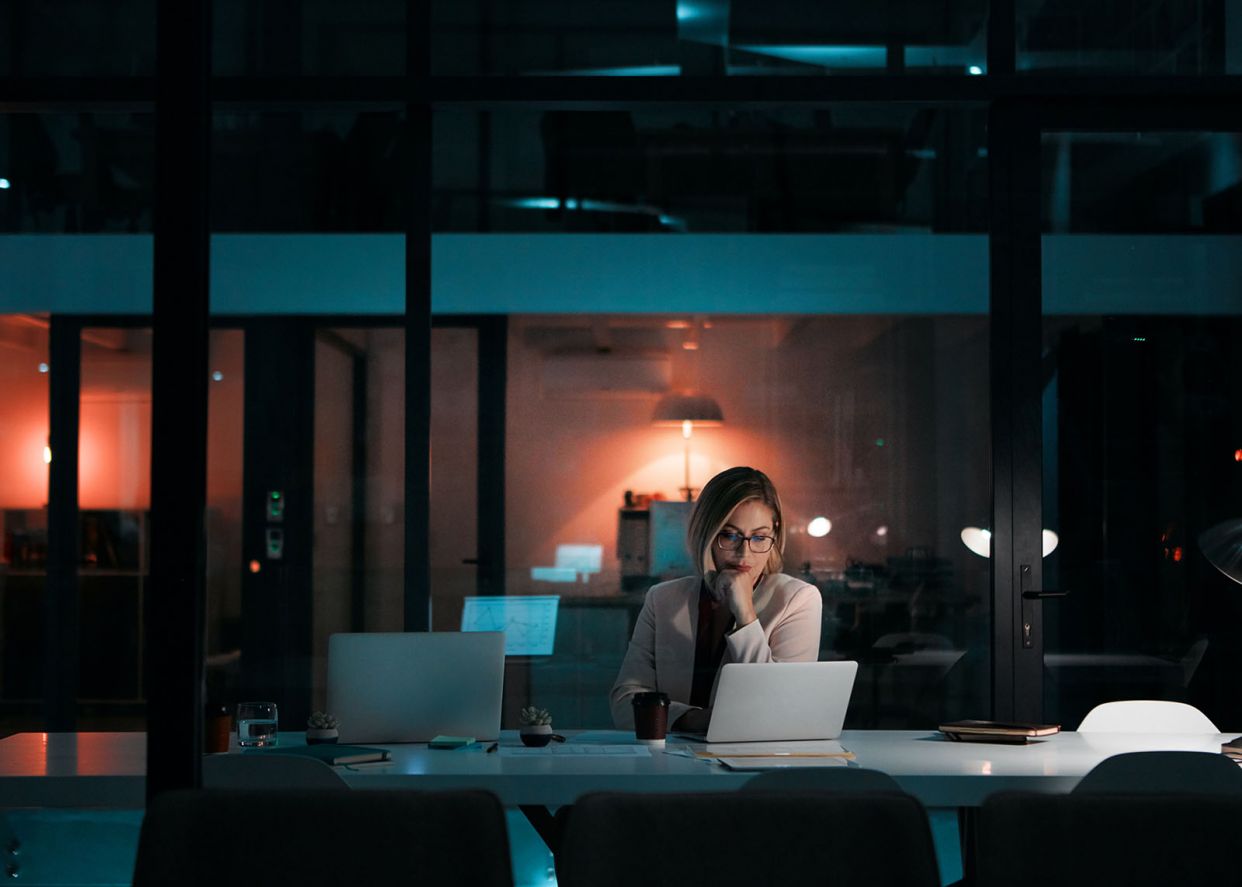 business woman working late on project
