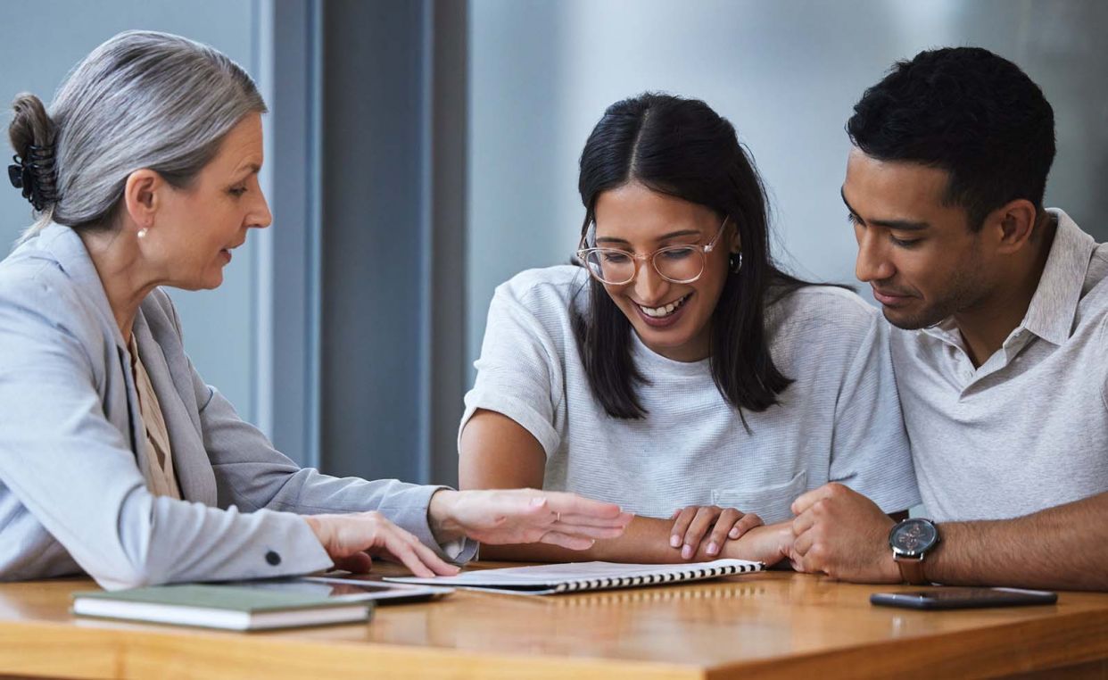 couple with financial advisor consulting