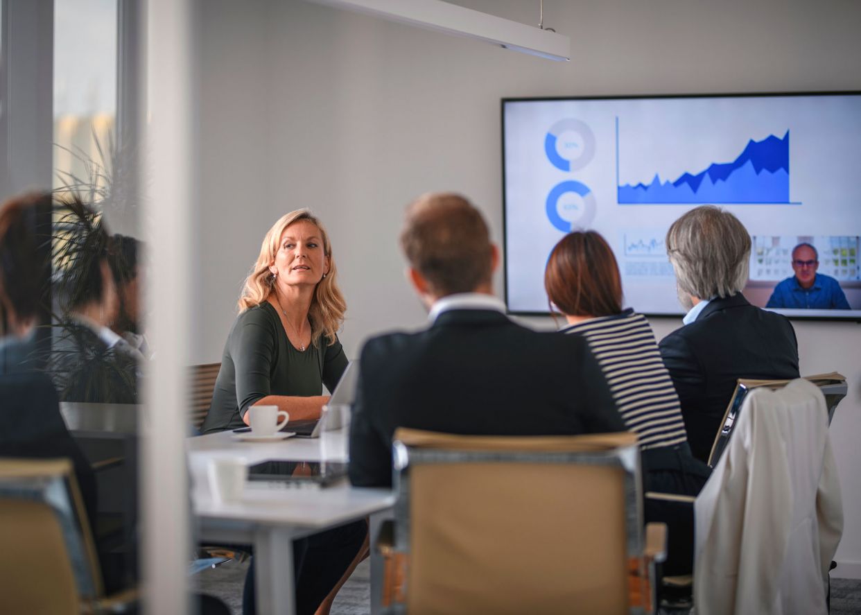 project manager listening during hybrid meeting