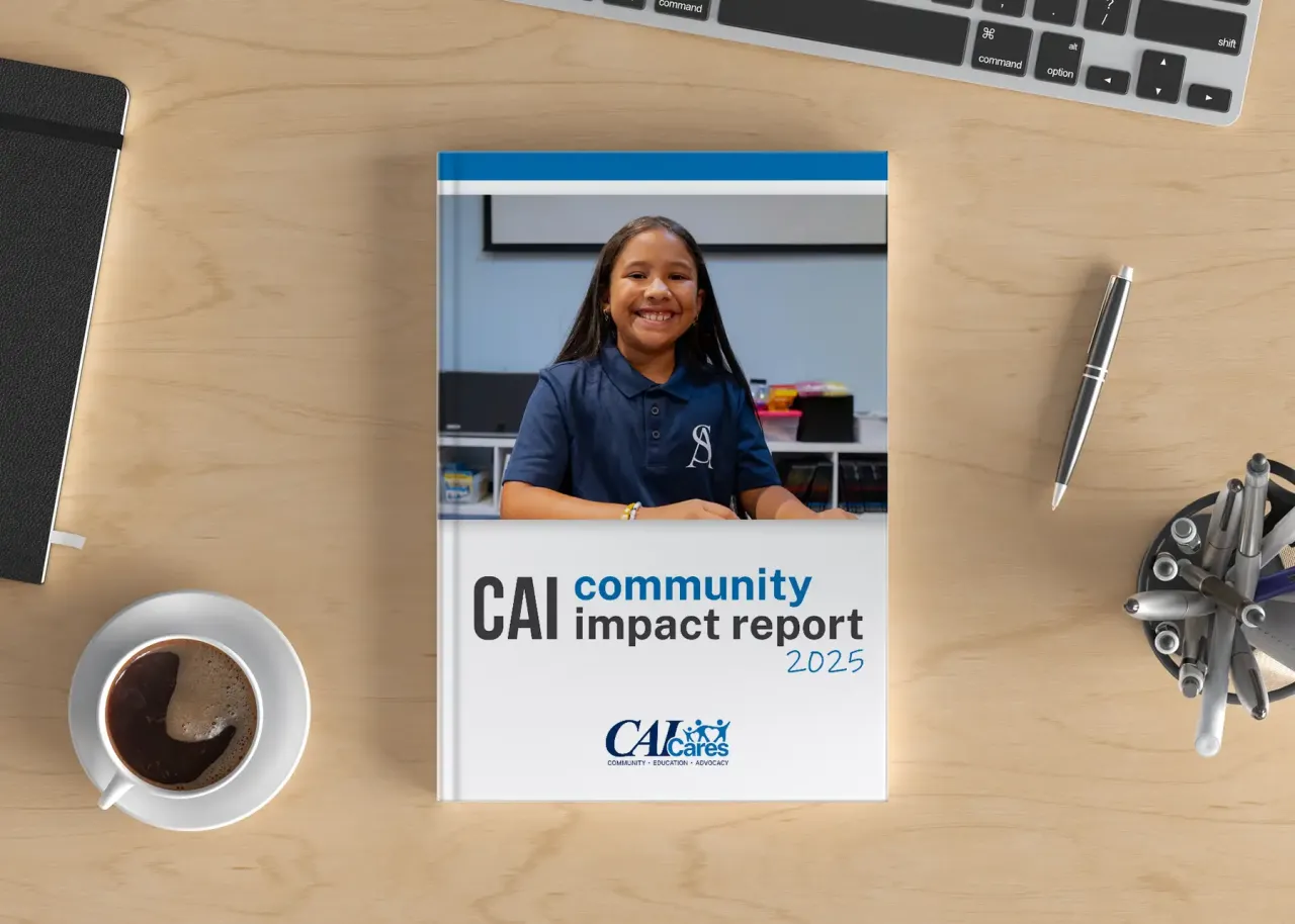 C A I C S R community impact report on a table